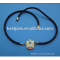 metal gold UAE falcon logo and leather necklace